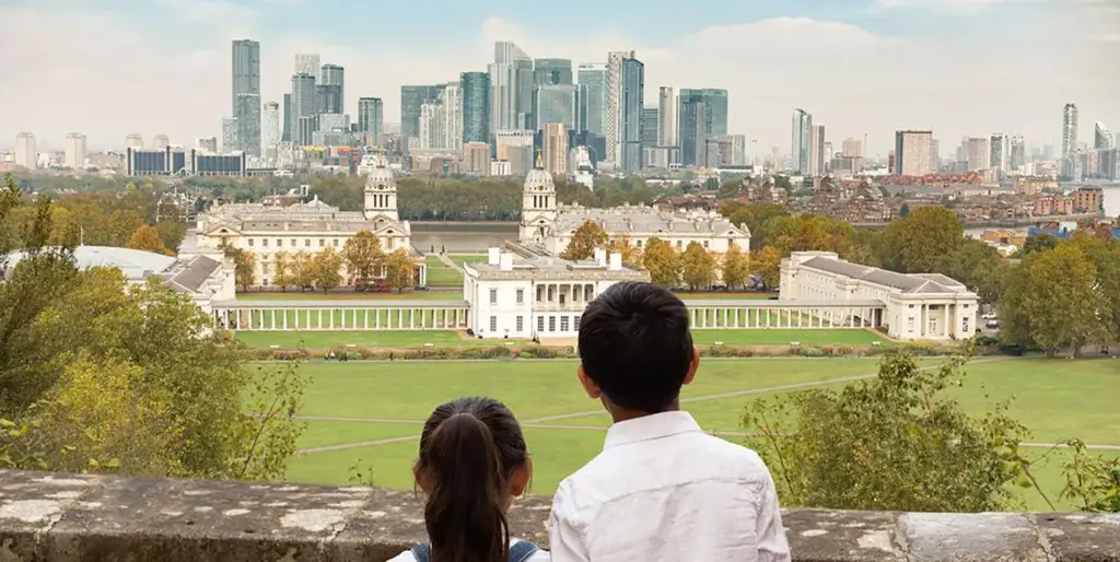 Two children looking at view of London skyline