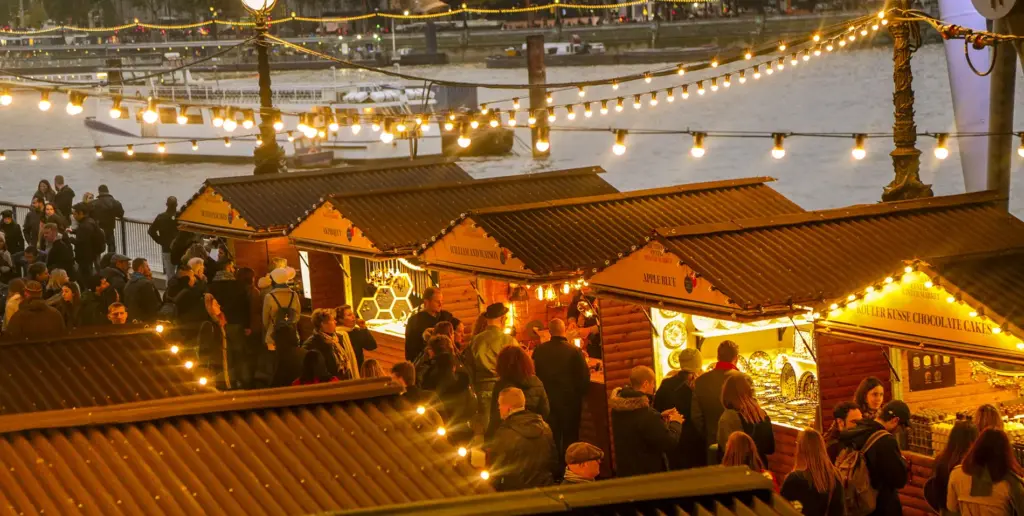 Chalet style market stalls by the river